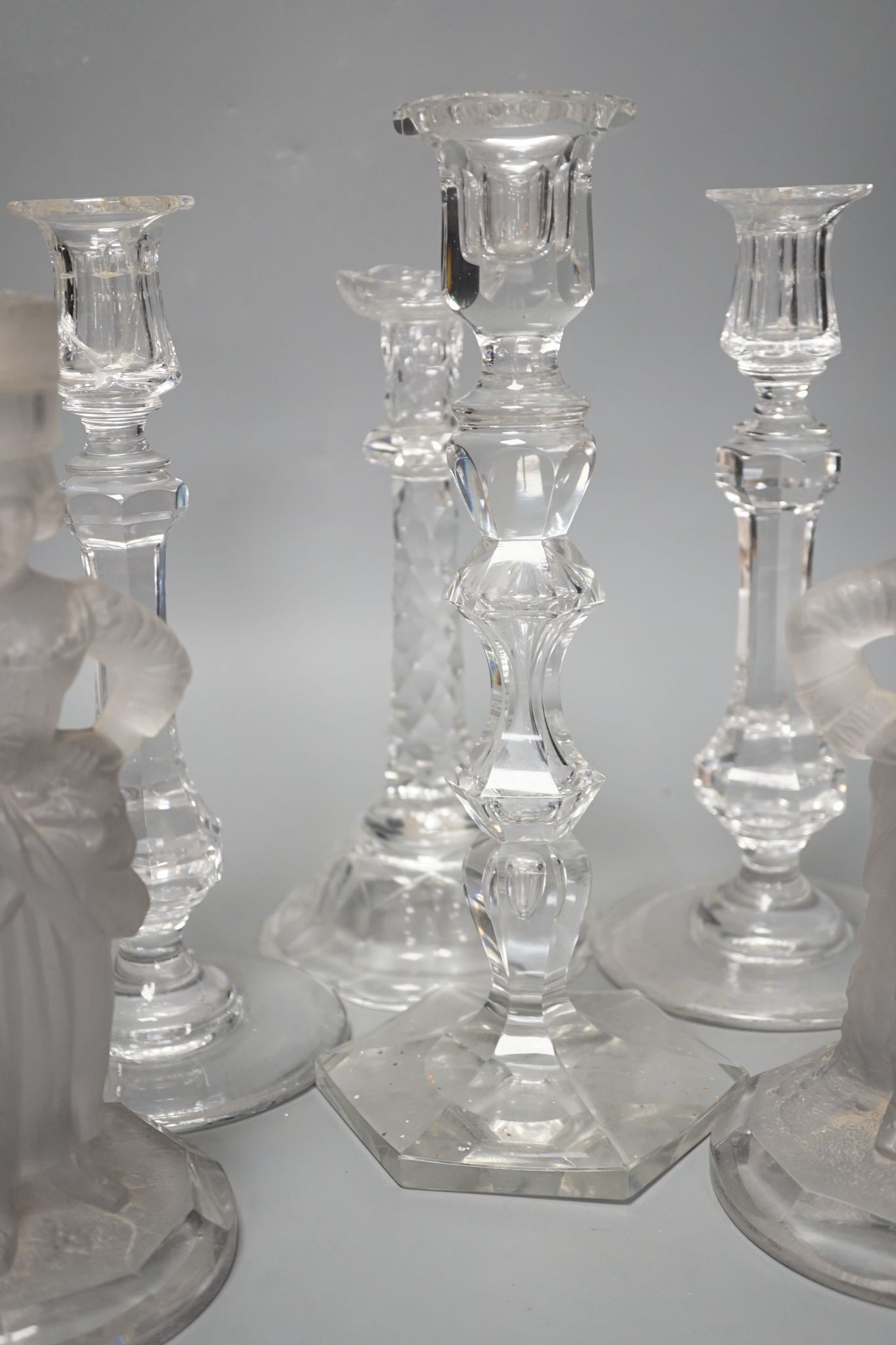Five various cut glass candlesticks, a pair of John Ford, Holyrood Glass Works, Edinburgh figural frosted glass candlesticks and a lustre drop bag chandelier